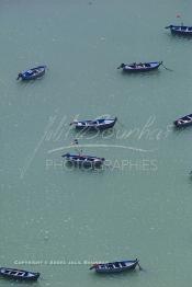 Image du Maroc Professionnelle de  Vue aérienne du port de pêche d'Asilah, ville du nord du Maroc sur l'océan Atlantique à 40 km au sud de Tanger, Vendredi 9 Août 2002.(Photo / Abdeljalil Bounhar)




